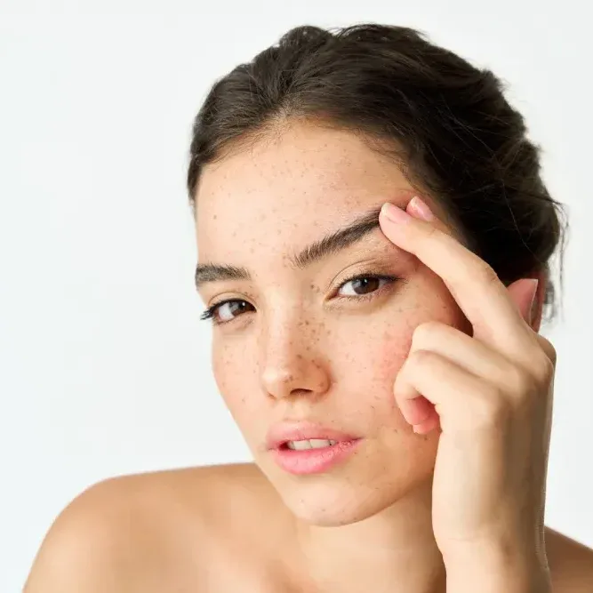 A woman with natural beauty, representing the genetic baseline that eyelash serums are designed to enhance, not fundamentally change.