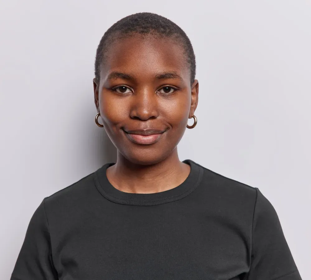 A smiling client's portrait, representing the trust placed in a specialist's expertise for a complex dark lip neutralization.