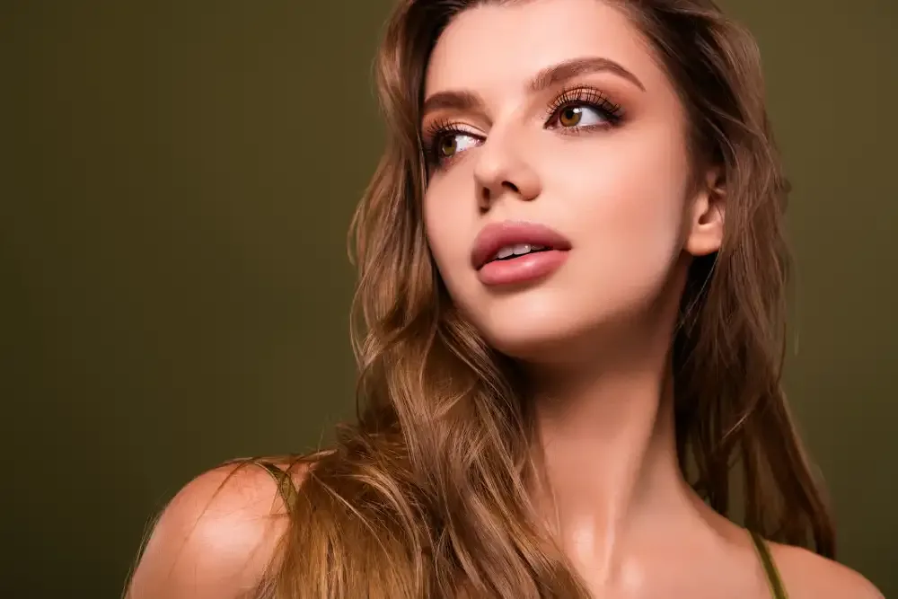 Woman wearing long, full lash extensions for a special occasion.