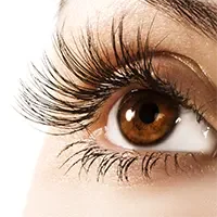Close-up showing enhanced eye with curved and darkened natural lashes after professional lift and tint service