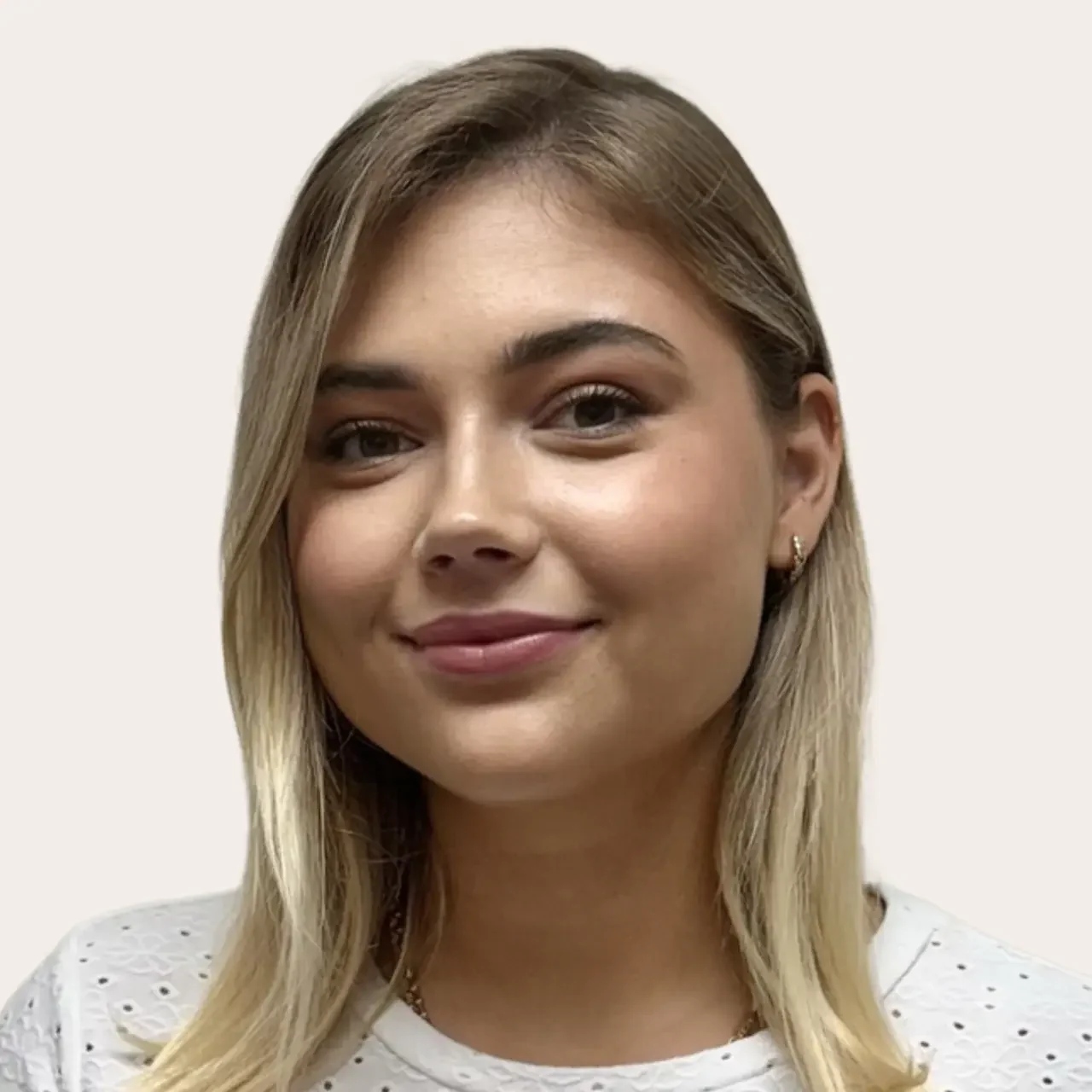 Professional esthetician Val with friendly smile, committed to quality skincare and personalized client service