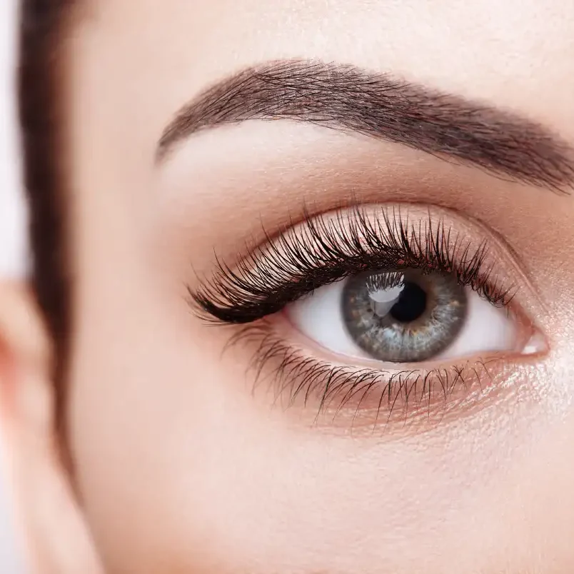 Woman wearing practical waterproof lash extensions with durable texture, enjoying carefree vacation swimming style