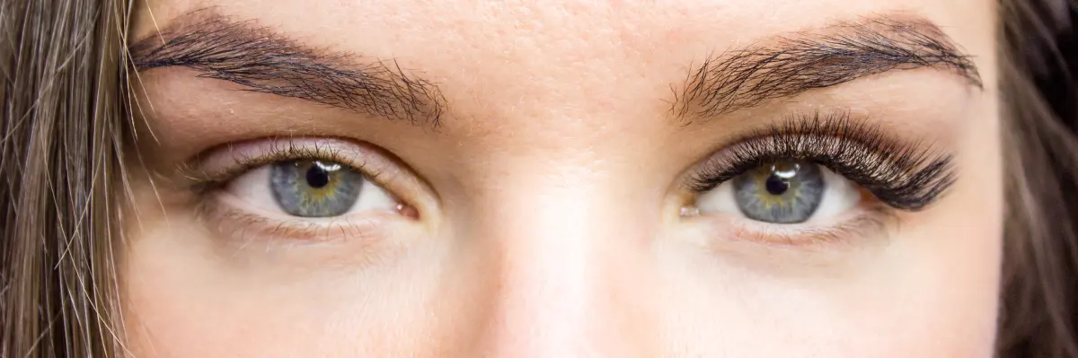 A before-and-after view of an eye, demonstrating the high level of customization possible with eyelash extensions.