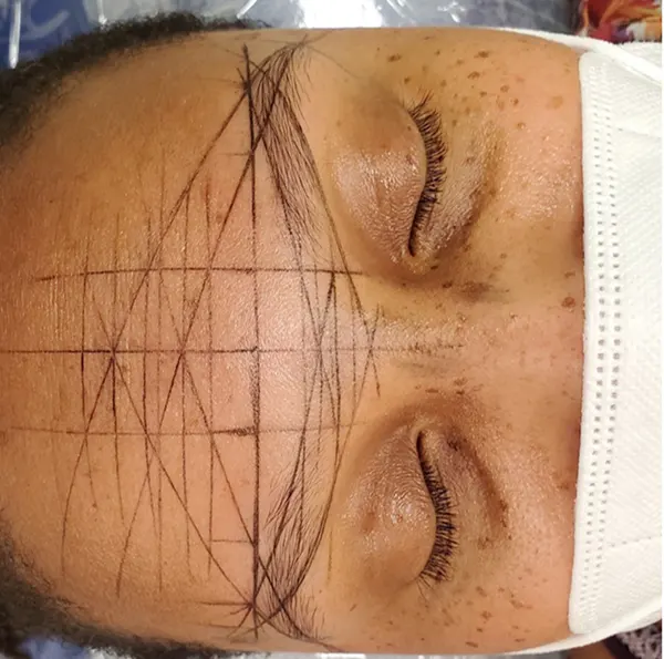 Microblading Client Mapping the Eyebrows